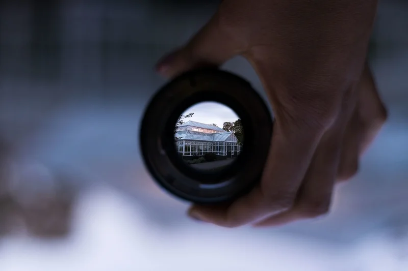 house-seen-through-the-circular-camera-lens