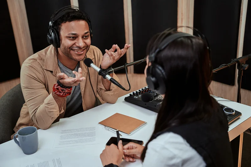 portait-of-happy-male-radio-host-smiling-talking