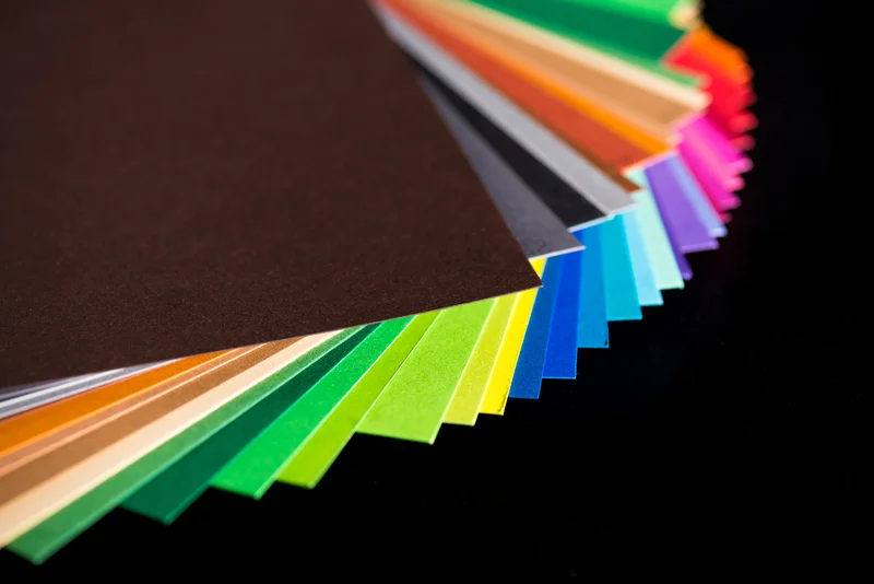 various-colorful-papers-isolated-on-black